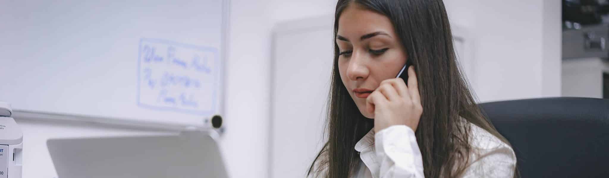 Woman discussing customer relationship management on phone