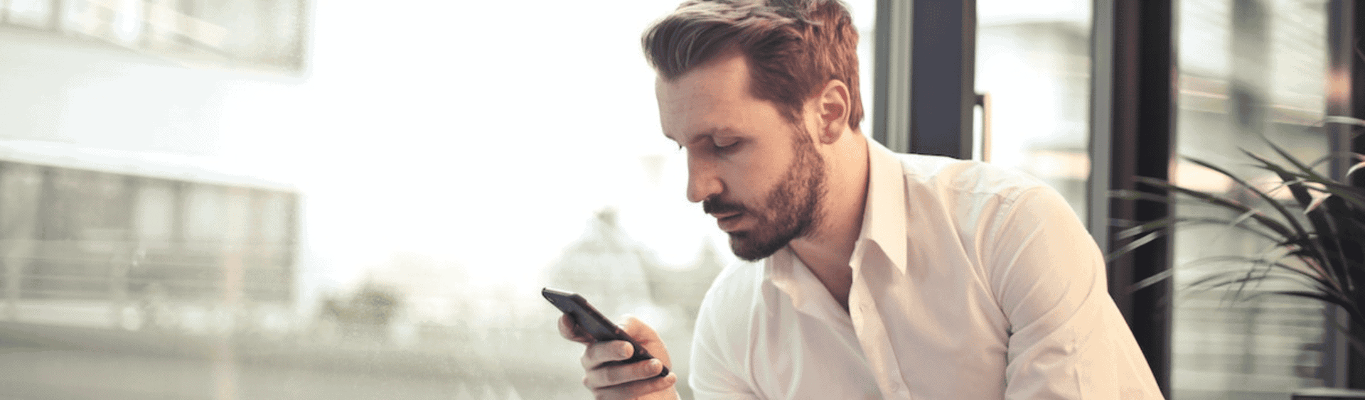 Businessman texting on phone