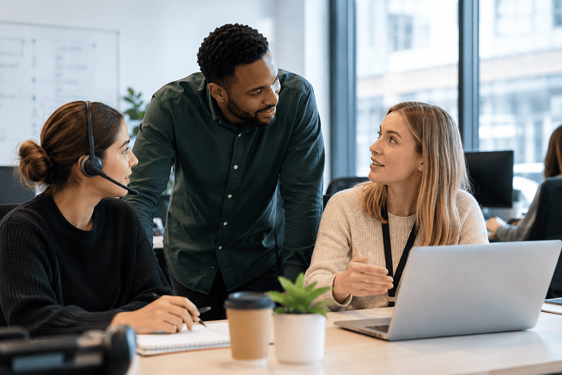 AI change management and AI-first support team collaborating in a modern office