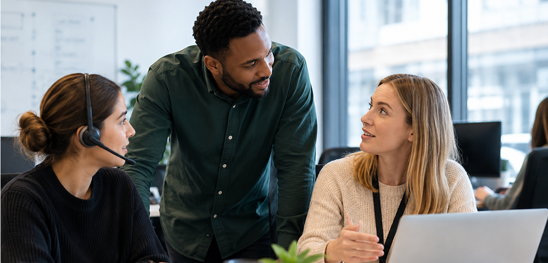 AI change management and AI-first support team collaborating in a modern office