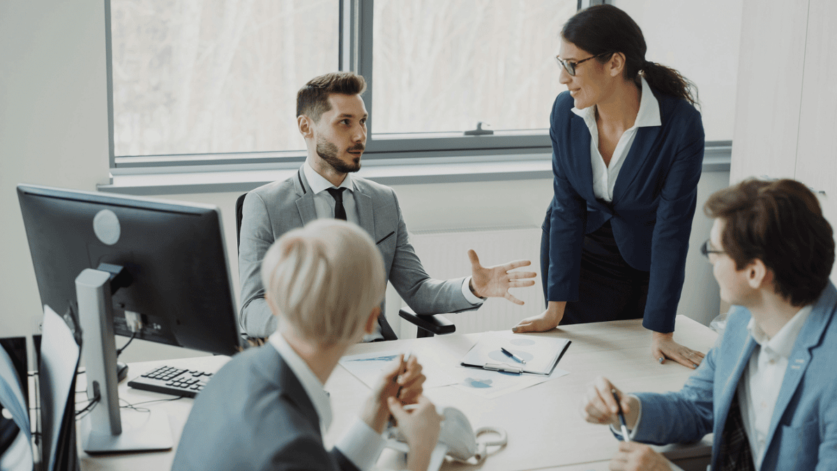 Business team discussing Fin AI Agent implementation and customer support automation strategy